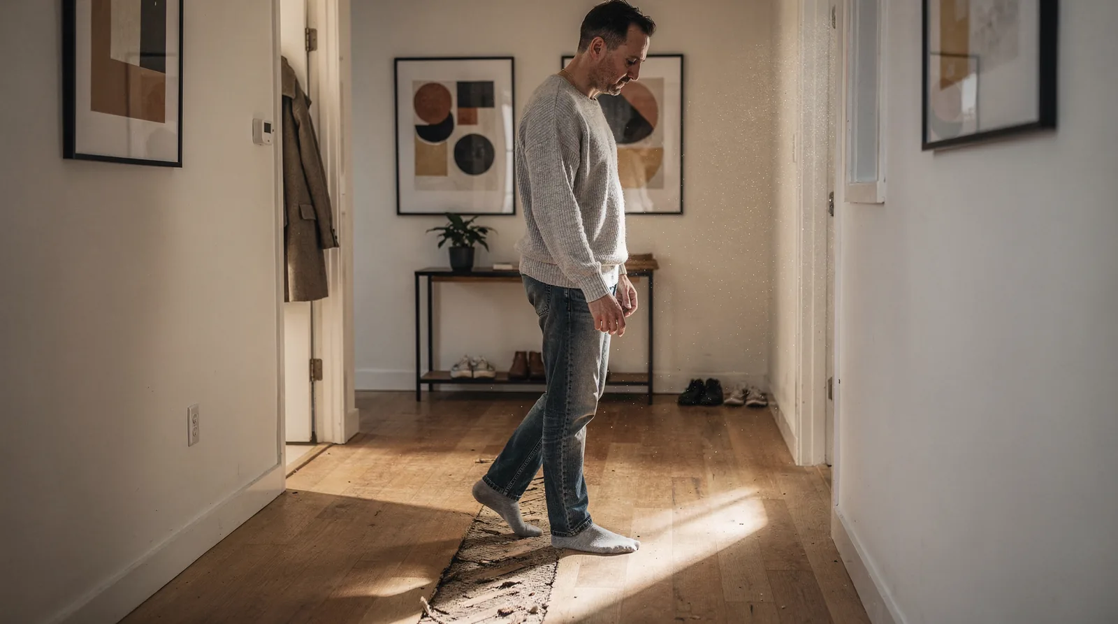 Man walking through hallway representing nervous system regulation and trauma healing.